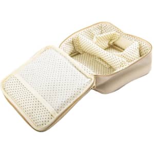 A large cream PU leather cosmetic bag with a handle, featuring an open interior with compartments and mesh pockets.