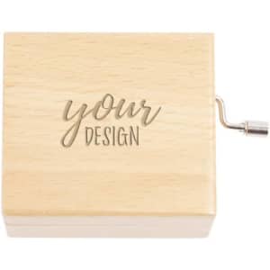 A wooden hand crank music box with a smooth finish and an engraved design on the lid.