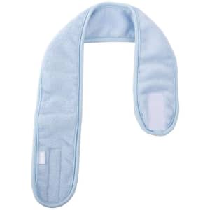 A light blue spa headband with a soft texture and adjustable fastener, designed for hair care and beauty routines.