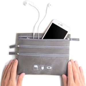 A grey cable organiser storage bag with three zippered pockets, holding earphones and a smartphone.