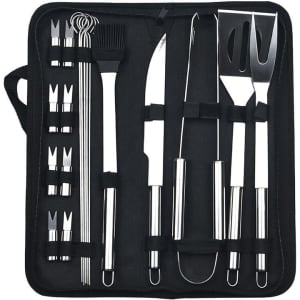 A stainless steel barbecue tool set in a black case, featuring tongs, spatula, brush, knife, and skewers.