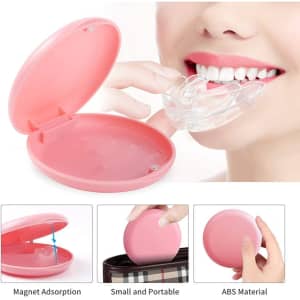 A pink orthodontic retainer case with a clear retainer inside, featuring a magnetic closure for portability.