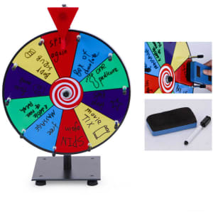 A tabletop spinner wheel featuring vibrant coloured sections with various activity prompts and a black stand.