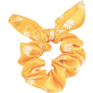 A yellow satin bow hair scrunchie adorned with white daisy patterns, featuring a decorative bow detail.