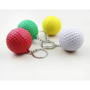 A set of four golf ball stress reliever keychains in red, green, yellow, and white, each attached to a metal keyring.