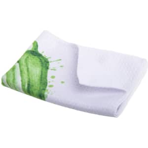 A folded kitchen towel featuring a white background with green splatter designs. It has a logo on the corner.