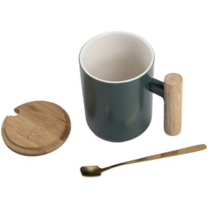 A green ceramic mug with a wood handle, a bamboo lid, and a gold spoon. It has a sleek, modern design.