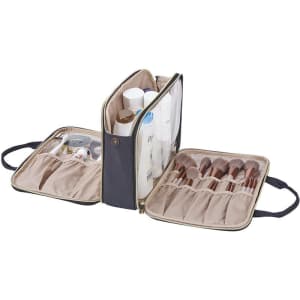 A waterproof cosmetic bag in navy with brush storage, featuring compartments for bottles and grooming tools.