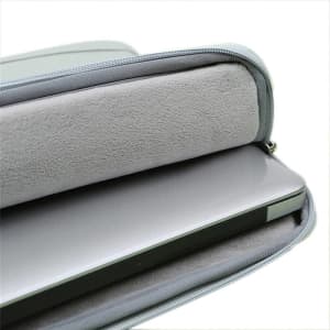 A grey custom Oxford laptop pocket sleeve with a soft interior, partially unzipped to reveal a laptop inside.