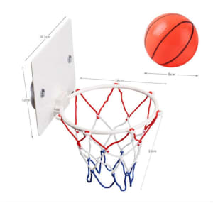 A mini basketball hoop with a white backboard and red, white, and blue net, accompanied by a small orange basketball.