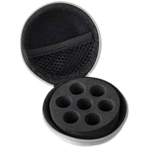 A round, black essential oil case with a zippered opening and six circular compartments inside.