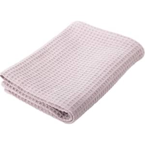 A folded waffle absorbent cotton kitchen towel in a soft lilac colour, featuring a textured design.