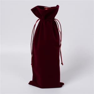 A drink bottle is enclosed in a burgundy flannel bag with a drawstring and a secured bottom. It has a logo.