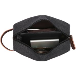 A dark grey toiletry bag with a handle, featuring a zippered opening and organised interior compartments.