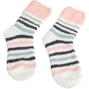 Fuzzy socks in white, pink, grey, and navy stripes, featuring a soft, plush texture. Includes a logo.