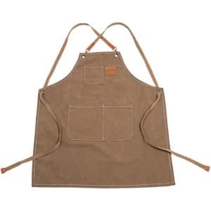 A waterproof canvas apron in brown with multiple pockets and leather detailing. It features adjustable straps and a logo.
