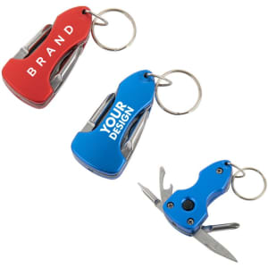 A set of three mini multi-tool pocket knives in red, blue, and silver, featuring keyring attachments and a logo.