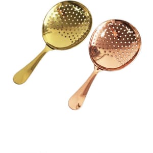 A gold and a copper cocktail strainer with a perforated design, featuring long handles. Each strainer has a shiny finish.
