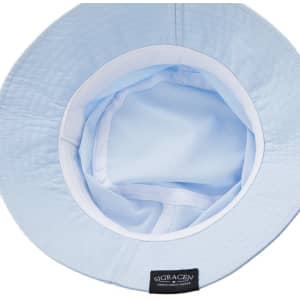 A light blue unisex foldable cotton bucket hat featuring a simple inner lining and a logo tag inside.