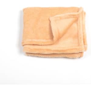 A folded pet flannel fleece blanket in a soft peach colour, featuring a slightly darker edge.
