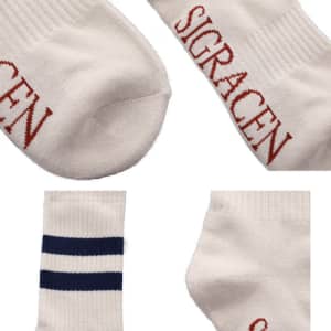 Striped tube crew socks in white with navy blue stripes and a logo in red.