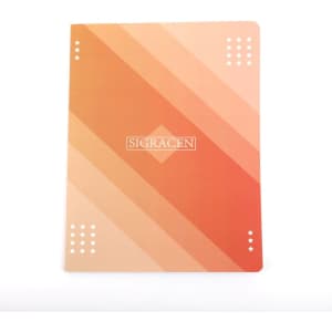 A softcover notebook with a gradient design in orange and peach tones, featuring a logo on the front.