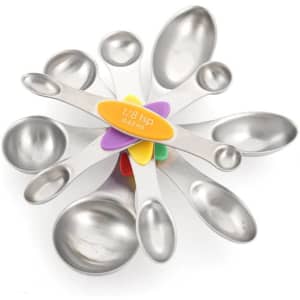A set of stainless steel coloured double-ended measuring spoons in various sizes arranged in a fan shape, with a central holder.