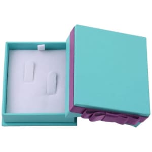 A turquoise and purple gift packaging box with a ribbon, featuring a white inner lining and two earring placeholders.