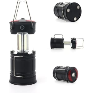 A foldable LED camping lantern in black, featuring a sturdy handle and multiple viewing angles. Brand logo visible.