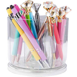 A transparent rotating pen holder containing various colourful pens, some with diamond-shaped tops.