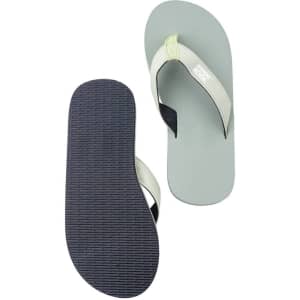 A pair of grey beach flip flops with a light green strap, featuring a textured black sole and a logo on the strap.