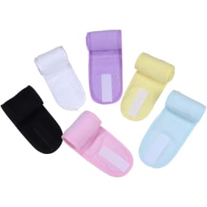 Five headbands in various colours: black, purple, pink, yellow, and blue, featuring a magic tape closure.