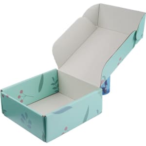 A small custom shipping packaging box in light blue with floral design, partially open to reveal the interior.