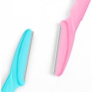Two eyebrow razors, one in blue and one in pink, featuring stainless steel blades and plastic handles.