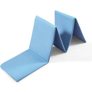 A foldable blue non-slip yoga mat with a textured surface, featuring a simplistic design and logo.