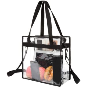 A clear zippered tote bag with black straps, filled with items like a drink bottle, apples, and a phone.