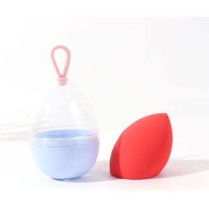 A pink lanyard holds a blue container next to a red beauty egg, designed for hair and beauty use.
