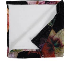 A folded 100% cotton bath towel featuring a vibrant floral pattern on one side and a white terry cloth backing.