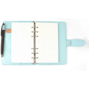 A6 macaron binder notebook in light blue, featuring a ring binder and blank dotted pages, with a pen.