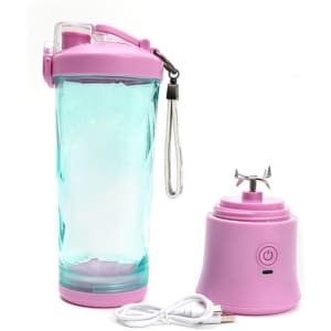 A drink bottle with a pink lid and base, clear body, and a portable blender base with a USB charging cable.