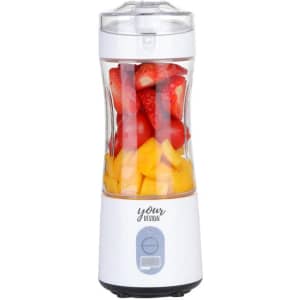A drink bottle with a white body, transparent container, and assorted fruits inside, featuring a logo on the side.