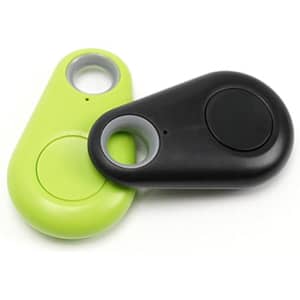 A green and black anti-lost device with a button and circular hole for attachment. It features a logo.