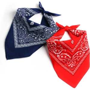Two square bandannas in navy blue and red with intricate paisley patterns and ties at the corners. Each has a logo.