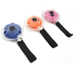 Three disc-shaped portable shopping bags in orange, pink, and blue, each with a black handle and a logo.