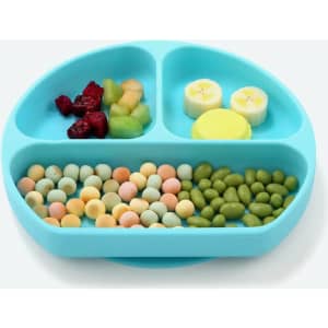 A silicone baby feeding plate in a light blue colour, featuring three sections filled with various foods.