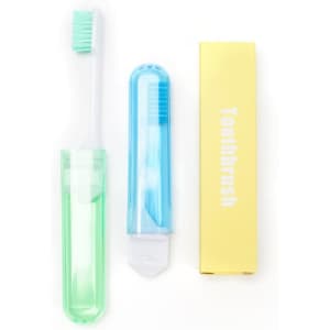 A travel folding toothbrush in green and blue, with a protective case and packaging. It features a logo on the case.