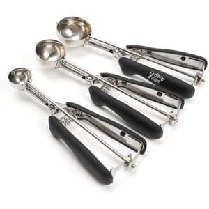 Three stainless steel ice cream scoops with black rubberised handles in varying sizes, featuring a branding logo.