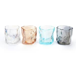 Four irregular-shaped whiskey cups in clear, amber, light blue, and grey colours, featuring a logo on each.
