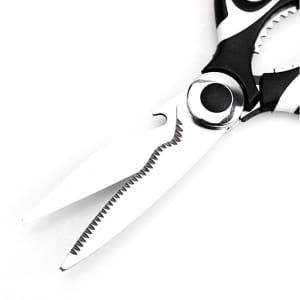 A pair of multifunctional food scissors in black and white with serrated edges for various cutting tasks.