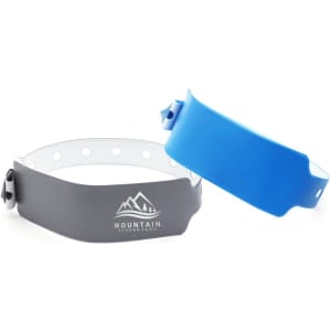 A grey and blue PVC custom adjustable wristband with a logo, featuring circular holes for adjustment.